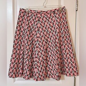 A-line pink,brown, and white geometric print skirt.